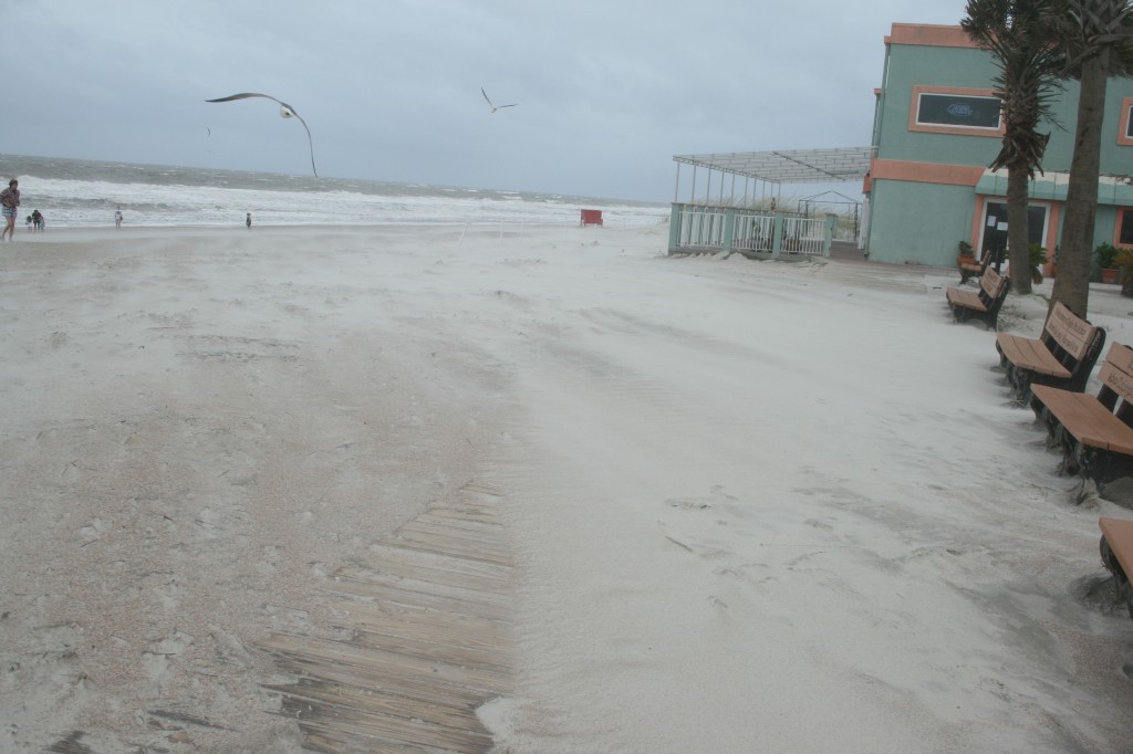 Sand blowing across the boards 